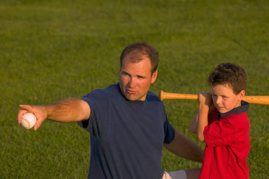 Father and son play baseball