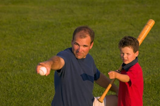 Father and son play baseball