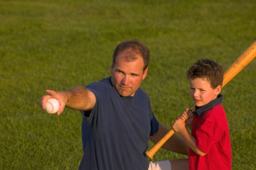 Father and son play baseball