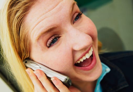 Teen talks on cell phone