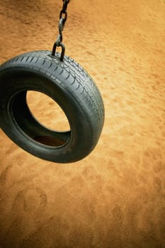 A tire swing in a playground