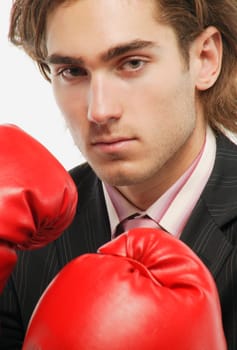 A businessman with boxing gloves
