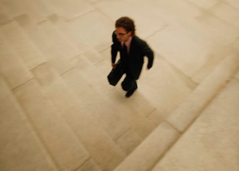 A businessman walks quickly