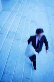 Businessman walks quickly