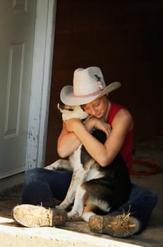 Girl hugging her dog