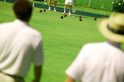 People lawn bowling