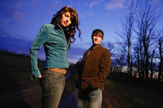 Young trendy man and woman outside