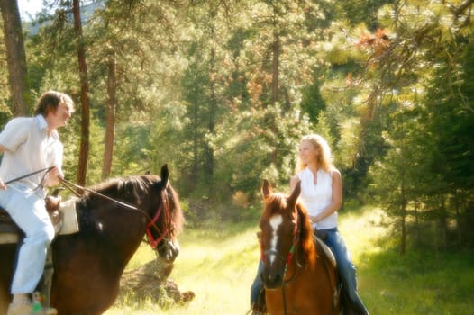 Man and woman on horseback
