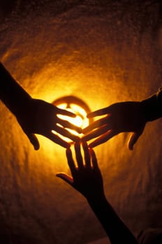 Hands over light