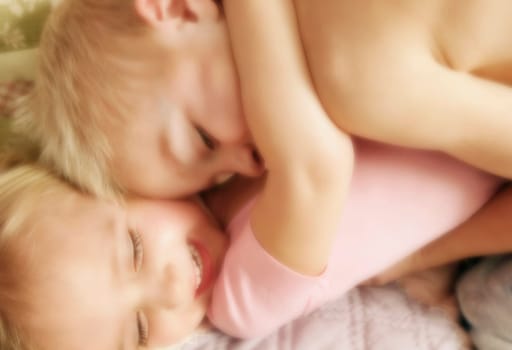 Two children hugging