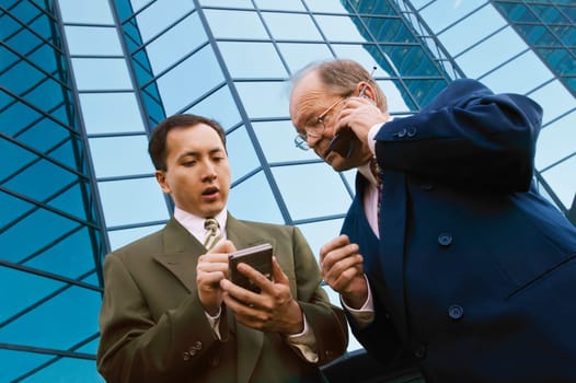 Businessmen outside office building