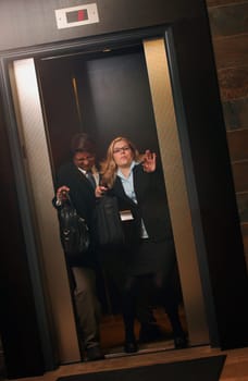 Fighting to get out of the elevator first