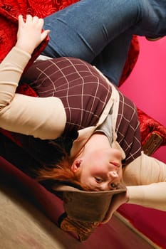 Lady upside down in chair