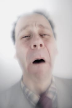Surreal closeup of older man upset