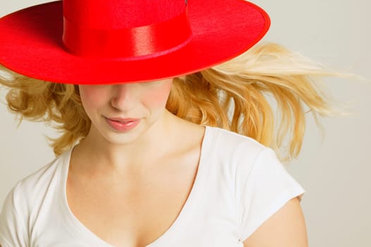 Model wearing fashionable red hat