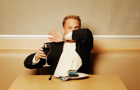 Man delving into his tie for dinner