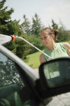 Woman washing the car