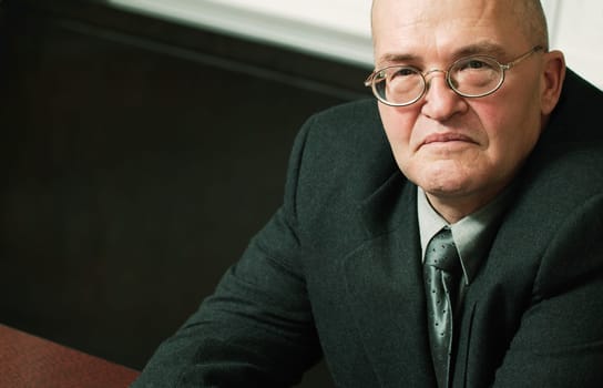 Stern looking older man