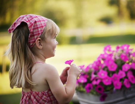 Little girl with pink flower
