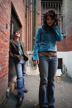 Fashionable couple in an alley