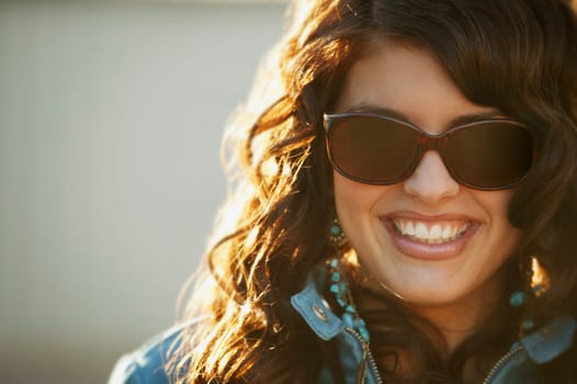 Attractive woman modeling trendy sunglasses