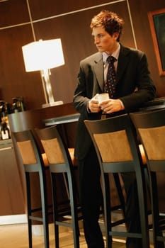 Businessman waiting with cup of coffee