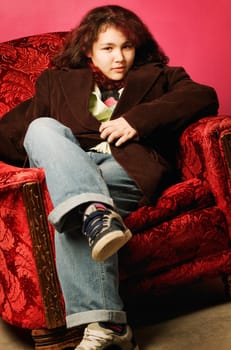 Teen girl sitting in chair