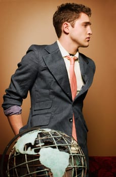 Young man with globe
