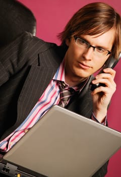 Businessman with phone and lap top