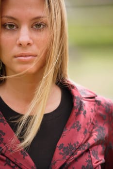 Blonde wearing red and black jacket