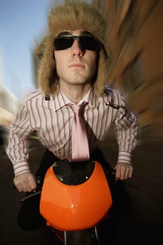 Man on a small motorbike