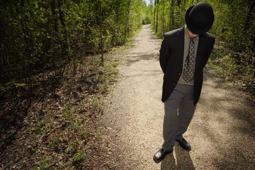 Businessman waiting in a wood