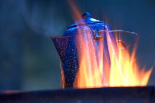 Camping kettle over fire