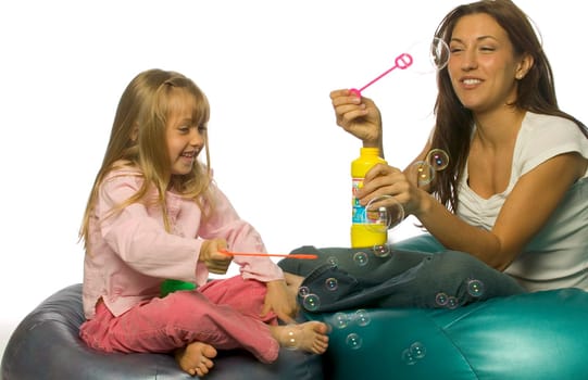 Mother and Daughter Blowing Bubbles