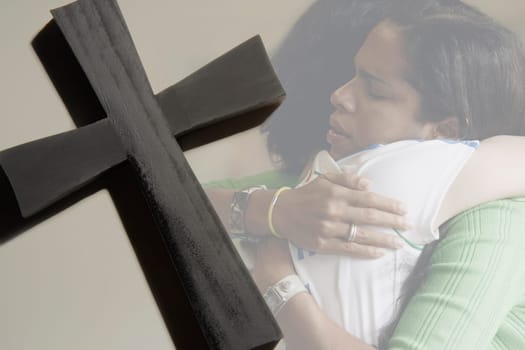 Women hugging, cross