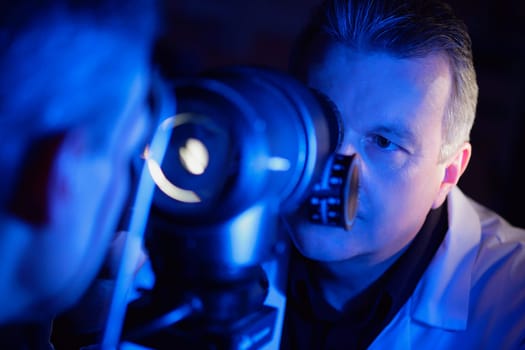 Optometrist administering an eye exam