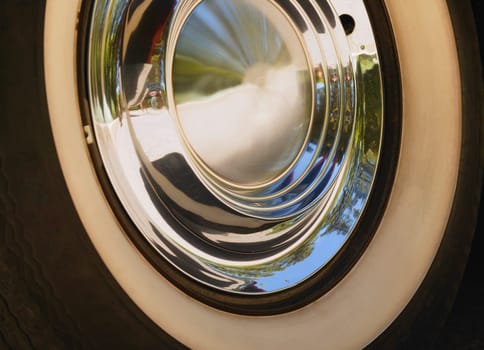 White-walled tire and chrome hub cap