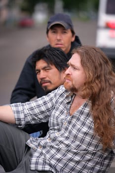 Three men sitting