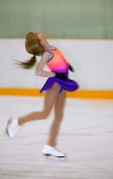 A young figure skater on the ice