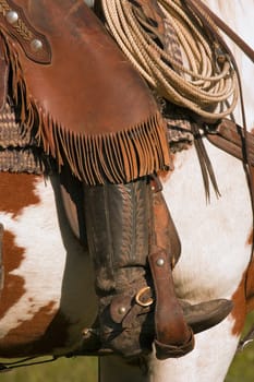 A close-up of a roper on horseback