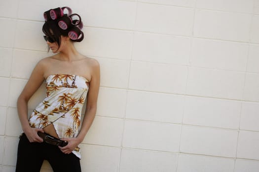 A woman with curlers in her hair