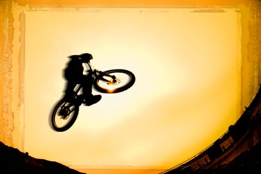Silhouette of stunt cyclist