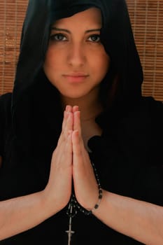 Woman with prayer beads