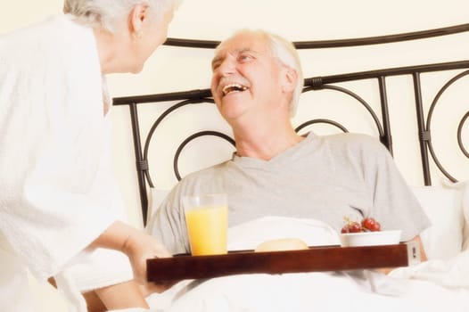 Man has breakfast in bed