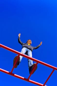 Child stands tall at playground