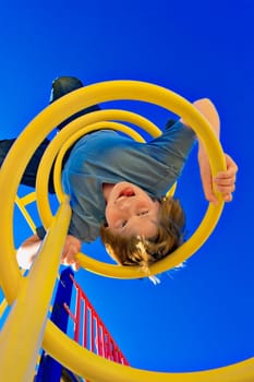 Child hangs on upside down