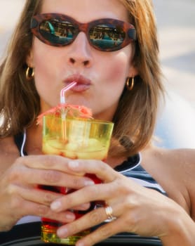 Woman drinks a refreshing beverage