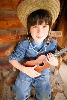 Cowboy strums a guitar