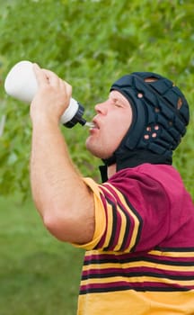 Rugby player drinking water