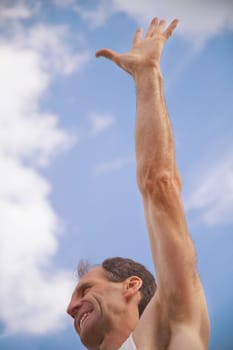 Man with arm raised